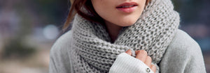 Woman wearing grey scarf
