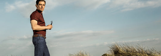 Man on the hill wearing jeans