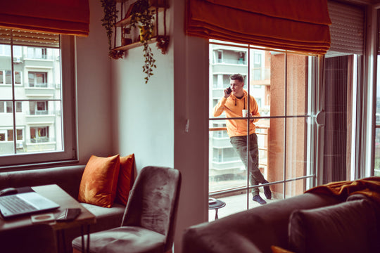 Man wearing loungewear talking on the phone