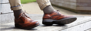 Man wearing brown brogue shoes